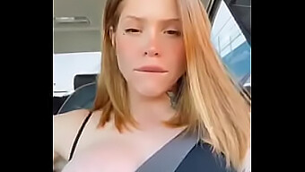 Busty Redhead Flaunts Her Assets While Driving